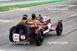 George Russell (GBR) Mercedes AMG F1 and Timo Glock (GER) in vintage race overalls in a 1924 Targa Florio Mercedes racing car. 16.05.2024. Formula 1 World Championship, Rd 7, Emilia Romagna Grand Prix, Imola, Italy, Preparation Day.