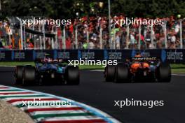 Lewis Hamilton (GBR) Mercedes AMG F1 W15 and Oscar Piastri (AUS) McLaren MCL38. 30.08.2024. Formula 1 World Championship, Rd 16, Italian Grand Prix, Monza, Italy, Practice Day.