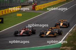 Race winner Charles Leclerc (MON) Ferrari SF-24 celebrates at the end of the race with Oscar Piastri (AUS) McLaren MCL38 and Lando Norris (GBR) McLaren MCL38. 01.09.2024. Formula 1 World Championship, Rd 16, Italian Grand Prix, Monza, Italy, Race Day.