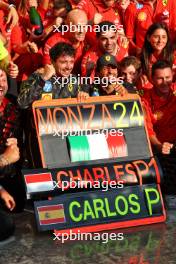 Race winner Charles Leclerc (MON) Ferrari celebrates with team mate Carlos Sainz Jr (ESP) Ferrari and the team. 01.09.2024. Formula 1 World Championship, Rd 16, Italian Grand Prix, Monza, Italy, Race Day.