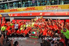 Race winner Charles Leclerc (MON) Ferrari celebrates with team mate Carlos Sainz Jr (ESP) Ferrari and the team. 01.09.2024. Formula 1 World Championship, Rd 16, Italian Grand Prix, Monza, Italy, Race Day.