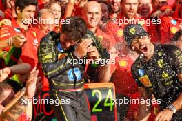 Race winner Charles Leclerc (MON) Ferrari celebrates with team mate Carlos Sainz Jr (ESP) Ferrari and the team. 01.09.2024. Formula 1 World Championship, Rd 16, Italian Grand Prix, Monza, Italy, Race Day.