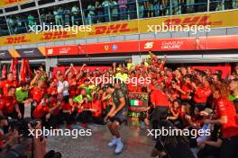 Race winner Charles Leclerc (MON) Ferrari celebrates with team mate Carlos Sainz Jr (ESP) Ferrari and the team. 01.09.2024. Formula 1 World Championship, Rd 16, Italian Grand Prix, Monza, Italy, Race Day.