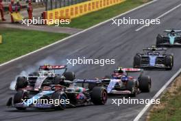 Esteban Ocon (FRA) Alpine F1 Team A524 as Nico Hulkenberg (GER) Haas VF-24 locks up under braking and hits Yuki Tsunoda (JPN) RB VCARB 01. 01.09.2024. Formula 1 World Championship, Rd 16, Italian Grand Prix, Monza, Italy, Race Day.