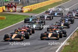 Lando Norris (GBR) McLaren MCL38 leads team mate Oscar Piastri (AUS) McLaren MCL38 at the start of the race. 01.09.2024. Formula 1 World Championship, Rd 16, Italian Grand Prix, Monza, Italy, Race Day.