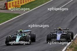 Fernando Alonso (ESP) Aston Martin F1 Team AMR24 and Franco Colapinto (ARG) Williams Racing FW46 battle for position. 01.09.2024. Formula 1 World Championship, Rd 16, Italian Grand Prix, Monza, Italy, Race Day.