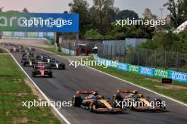 Oscar Piastri (AUS) McLaren MCL38 and Lando Norris (GBR) McLaren MCL38 battle for the lead at the start of the race. 01.09.2024. Formula 1 World Championship, Rd 16, Italian Grand Prix, Monza, Italy, Race Day.