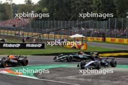 Sergio Perez (MEX) Red Bull Racing RB20 and Alexander Albon (THA) Williams Racing FW46 battle for position. 01.09.2024. Formula 1 World Championship, Rd 16, Italian Grand Prix, Monza, Italy, Race Day.