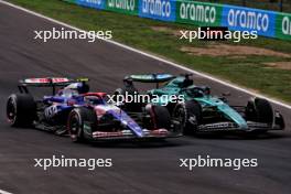 Yuki Tsunoda (JPN) RB VCARB 01 and Lance Stroll (CDN) Aston Martin F1 Team AMR24 battle for position. 01.09.2024. Formula 1 World Championship, Rd 16, Italian Grand Prix, Monza, Italy, Race Day.