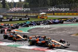 Lando Norris (GBR) McLaren MCL38 leads team mate Oscar Piastri (AUS) McLaren MCL38 at the start of the race. 01.09.2024. Formula 1 World Championship, Rd 16, Italian Grand Prix, Monza, Italy, Race Day.