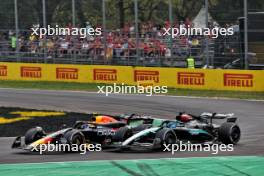 Sergio Perez (MEX) Red Bull Racing RB20 and George Russell (GBR) Mercedes AMG F1 W15 battle for position. 01.09.2024. Formula 1 World Championship, Rd 16, Italian Grand Prix, Monza, Italy, Race Day.