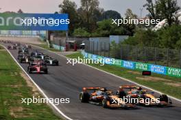 Oscar Piastri (AUS) McLaren MCL38 and Lando Norris (GBR) McLaren MCL38 battle for the lead at the start of the race. 01.09.2024. Formula 1 World Championship, Rd 16, Italian Grand Prix, Monza, Italy, Race Day.