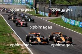 Oscar Piastri (AUS) McLaren MCL38 and Lando Norris (GBR) McLaren MCL38 battle for the lead at the start of the race. 01.09.2024. Formula 1 World Championship, Rd 16, Italian Grand Prix, Monza, Italy, Race Day.