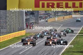 Lando Norris (GBR) McLaren MCL38 leads team mate Oscar Piastri (AUS) McLaren MCL38 at the start of the race. 01.09.2024. Formula 1 World Championship, Rd 16, Italian Grand Prix, Monza, Italy, Race Day.