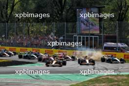 Lando Norris (GBR) McLaren MCL38 leads team mate Oscar Piastri (AUS) McLaren MCL38 at the start of the race as George Russell (GBR) Mercedes AMG F1 W15 runs wide. 01.09.2024. Formula 1 World Championship, Rd 16, Italian Grand Prix, Monza, Italy, Race Day.