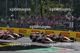 Lando Norris (GBR) McLaren MCL38 leads team mate Oscar Piastri (AUS) McLaren MCL38 at the start of the race. 01.09.2024. Formula 1 World Championship, Rd 16, Italian Grand Prix, Monza, Italy, Race Day.