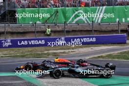 Sergio Perez (MEX) Red Bull Racing RB20 and George Russell (GBR) Mercedes AMG F1 W15 battle for position. 01.09.2024. Formula 1 World Championship, Rd 16, Italian Grand Prix, Monza, Italy, Race Day.