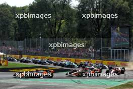 Lando Norris (GBR) McLaren MCL38 leads team mate Oscar Piastri (AUS) McLaren MCL38 at the start of the race. 01.09.2024. Formula 1 World Championship, Rd 16, Italian Grand Prix, Monza, Italy, Race Day.