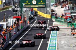 Charles Leclerc (MON) Ferrari SF-24 and Carlos Sainz Jr (ESP) Ferrari SF-24 leave the pits. 31.08.2024. Formula 1 World Championship, Rd 16, Italian Grand Prix, Monza, Italy, Qualifying Day.