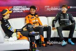 (L to R): Oscar Piastri (AUS) McLaren; Lando Norris (GBR) McLaren; and George Russell (GBR) Mercedes AMG F1, in the post qualifying FIA Press Conference. 31.08.2024. Formula 1 World Championship, Rd 16, Italian Grand Prix, Monza, Italy, Qualifying Day.