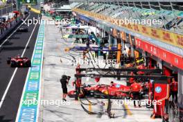 Charles Leclerc (MON) Ferrari SF-24 and Carlos Sainz Jr (ESP) Ferrari SF-24 leave the pits. 31.08.2024. Formula 1 World Championship, Rd 16, Italian Grand Prix, Monza, Italy, Qualifying Day.