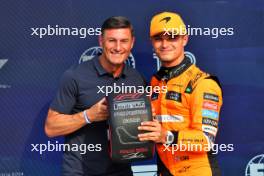 Lando Norris (GBR) McLaren receives the Pirelli Pole Position Award in qualifying parc ferme from Javier Zanetti (ARG) Former Football Player. 31.08.2024. Formula 1 World Championship, Rd 16, Italian Grand Prix, Monza, Italy, Qualifying Day.