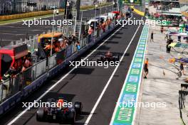 Max Verstappen (NLD) Red Bull Racing RB20 and Sergio Perez (MEX) Red Bull Racing RB20 leave the pits. 31.08.2024. Formula 1 World Championship, Rd 16, Italian Grand Prix, Monza, Italy, Qualifying Day.