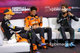 (L to R): Oscar Piastri (AUS) McLaren; Lando Norris (GBR) McLaren; and George Russell (GBR) Mercedes AMG F1, in the post qualifying FIA Press Conference. 31.08.2024. Formula 1 World Championship, Rd 16, Italian Grand Prix, Monza, Italy, Qualifying Day.