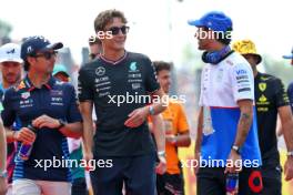 (L to R): Sergio Perez (MEX) Red Bull Racing with George Russell (GBR) Mercedes AMG F1 and Daniel Ricciardo (AUS) RB on the drivers' parade. 01.09.2024. Formula 1 World Championship, Rd 16, Italian Grand Prix, Monza, Italy, Race Day.