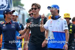 (L to R): Sergio Perez (MEX) Red Bull Racing with George Russell (GBR) Mercedes AMG F1 and Daniel Ricciardo (AUS) RB on the drivers' parade. 01.09.2024. Formula 1 World Championship, Rd 16, Italian Grand Prix, Monza, Italy, Race Day.