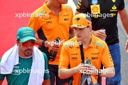 (L to R): Fernando Alonso (ESP) Aston Martin F1 Team with Oscar Piastri (AUS) McLaren on the drivers' parade. 01.09.2024. Formula 1 World Championship, Rd 16, Italian Grand Prix, Monza, Italy, Race Day.