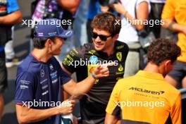 (L to R): Alexander Albon (THA) Williams Racing FW46; Charles Leclerc (MON) Ferrari; and Lando Norris (GBR) McLaren, on the drivers' parade. 01.09.2024. Formula 1 World Championship, Rd 16, Italian Grand Prix, Monza, Italy, Race Day.