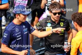 (L to R): Alexander Albon (THA) Williams Racing FW46; Charles Leclerc (MON) Ferrari; and Lando Norris (GBR) McLaren, on the drivers' parade. 01.09.2024. Formula 1 World Championship, Rd 16, Italian Grand Prix, Monza, Italy, Race Day.