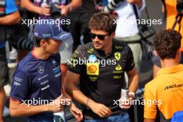 (L to R): Alexander Albon (THA) Williams Racing FW46; Charles Leclerc (MON) Ferrari; and Lando Norris (GBR) McLaren, on the drivers' parade. 01.09.2024. Formula 1 World Championship, Rd 16, Italian Grand Prix, Monza, Italy, Race Day.