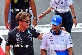 (L to R): George Russell (GBR) Mercedes AMG F1 with Daniel Ricciardo (AUS) RB on the drivers' parade. 01.09.2024. Formula 1 World Championship, Rd 16, Italian Grand Prix, Monza, Italy, Race Day.