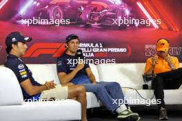 (L to R): Sergio Perez (MEX) Red Bull Racing; Alexander Albon (THA) Williams Racing; and Lando Norris (GBR) McLaren, in the FIA Press Conference. 29.08.2024. Formula 1 World Championship, Rd 16, Italian Grand Prix, Monza, Italy, Preparation Day.