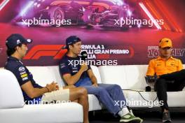 (L to R): Sergio Perez (MEX) Red Bull Racing; Alexander Albon (THA) Williams Racing; and Lando Norris (GBR) McLaren, in the FIA Press Conference. 29.08.2024. Formula 1 World Championship, Rd 16, Italian Grand Prix, Monza, Italy, Preparation Day.