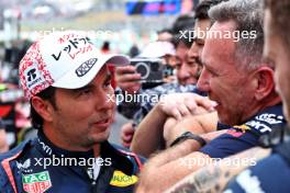 Second placed Sergio Perez (MEX) Red Bull Racing with Christian Horner (GBR) Red Bull Racing Team Principal in parc ferme. 07.04.2024. Formula 1 World Championship, Rd 4, Japanese Grand Prix, Suzuka, Japan, Race Day.