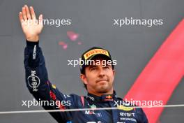Sergio Perez (MEX) Red Bull Racing celebrates his second position on the podium. 07.04.2024. Formula 1 World Championship, Rd 4, Japanese Grand Prix, Suzuka, Japan, Race Day.