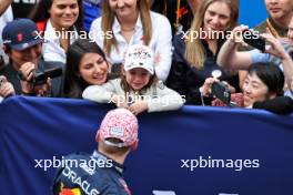 Race winner Max Verstappen (NLD) Red Bull Racing celebrates in parc ferme with girlfriend Kelly Piquet (BRA) and her daughter Penelope. 07.04.2024. Formula 1 World Championship, Rd 4, Japanese Grand Prix, Suzuka, Japan, Race Day.