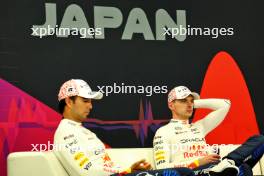 (L to R): Max Verstappen (NLD) Red Bull Racing and team mate Sergio Perez (MEX) Red Bull Racing, in the post race FIA Press Conference. 07.04.2024. Formula 1 World Championship, Rd 4, Japanese Grand Prix, Suzuka, Japan, Race Day.