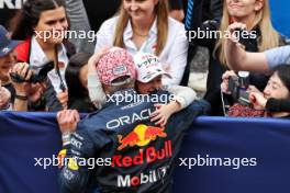 Race winner Max Verstappen (NLD) Red Bull Racing celebrates in parc ferme with girlfriend Kelly Piquet (BRA) and her daughter Penelope.  07.04.2024. Formula 1 World Championship, Rd 4, Japanese Grand Prix, Suzuka, Japan, Race Day.
