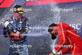 (L to R): Race winner Max Verstappen (NLD) Red Bull Racing celebrates on the podium with third placed Carlos Sainz Jr (ESP) Ferrari. 07.04.2024. Formula 1 World Championship, Rd 4, Japanese Grand Prix, Suzuka, Japan, Race Day.