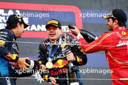 The podium (L to R): Sergio Perez (MEX) Red Bull Racing, second; Max Verstappen (NLD) Red Bull Racing, race winner; Carlos Sainz Jr (ESP) Ferrari, third. 07.04.2024. Formula 1 World Championship, Rd 4, Japanese Grand Prix, Suzuka, Japan, Race Day.