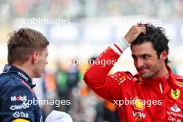 (L to R): Race winner Max Verstappen (NLD) Red Bull Racing with third placed Carlos Sainz Jr (ESP) Ferrari in parc ferme. 07.04.2024. Formula 1 World Championship, Rd 4, Japanese Grand Prix, Suzuka, Japan, Race Day.
