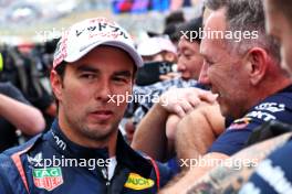Second placed Sergio Perez (MEX) Red Bull Racing with Christian Horner (GBR) Red Bull Racing Team Principal in parc ferme. 07.04.2024. Formula 1 World Championship, Rd 4, Japanese Grand Prix, Suzuka, Japan, Race Day.