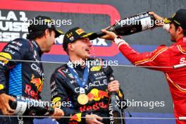 The podium (L to R): Sergio Perez (MEX) Red Bull Racing, second; Max Verstappen (NLD) Red Bull Racing, race winner; Carlos Sainz Jr (ESP) Ferrari, third. 07.04.2024. Formula 1 World Championship, Rd 4, Japanese Grand Prix, Suzuka, Japan, Race Day.