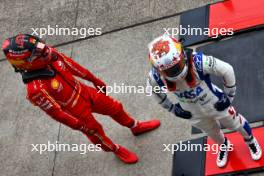 (L to R): Carlos Sainz Jr (ESP) Ferrari and Yuki Tsunoda (JPN) RB in qualifying parc ferme. 06.04.2024. Formula 1 World Championship, Rd 4, Japanese Grand Prix, Suzuka, Japan, Qualifying Day.