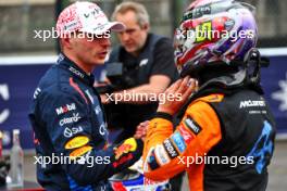 (L to R): Max Verstappen (NLD) Red Bull Racing celebrates his pole position with third placed Lando Norris (GBR) McLaren in qualifying parc ferme. 06.04.2024. Formula 1 World Championship, Rd 4, Japanese Grand Prix, Suzuka, Japan, Qualifying Day.