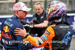 (L to R): Max Verstappen (NLD) Red Bull Racing celebrates his pole position with third placed Lando Norris (GBR) McLaren in qualifying parc ferme. 06.04.2024. Formula 1 World Championship, Rd 4, Japanese Grand Prix, Suzuka, Japan, Qualifying Day.